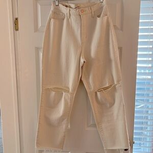 Cream Universal Threads jeans with raw hem and rips in the knees!